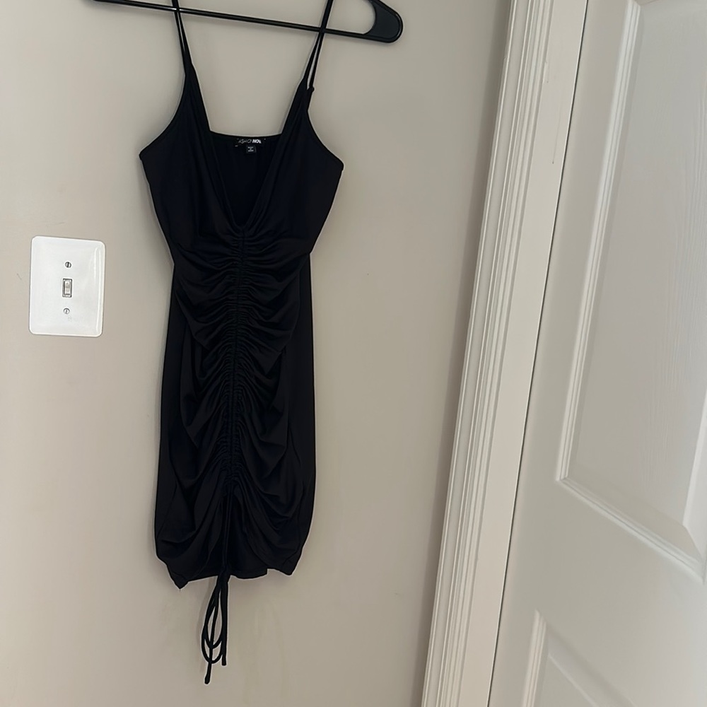 Fashion Nova simple black stretch with front ruched detail dress!